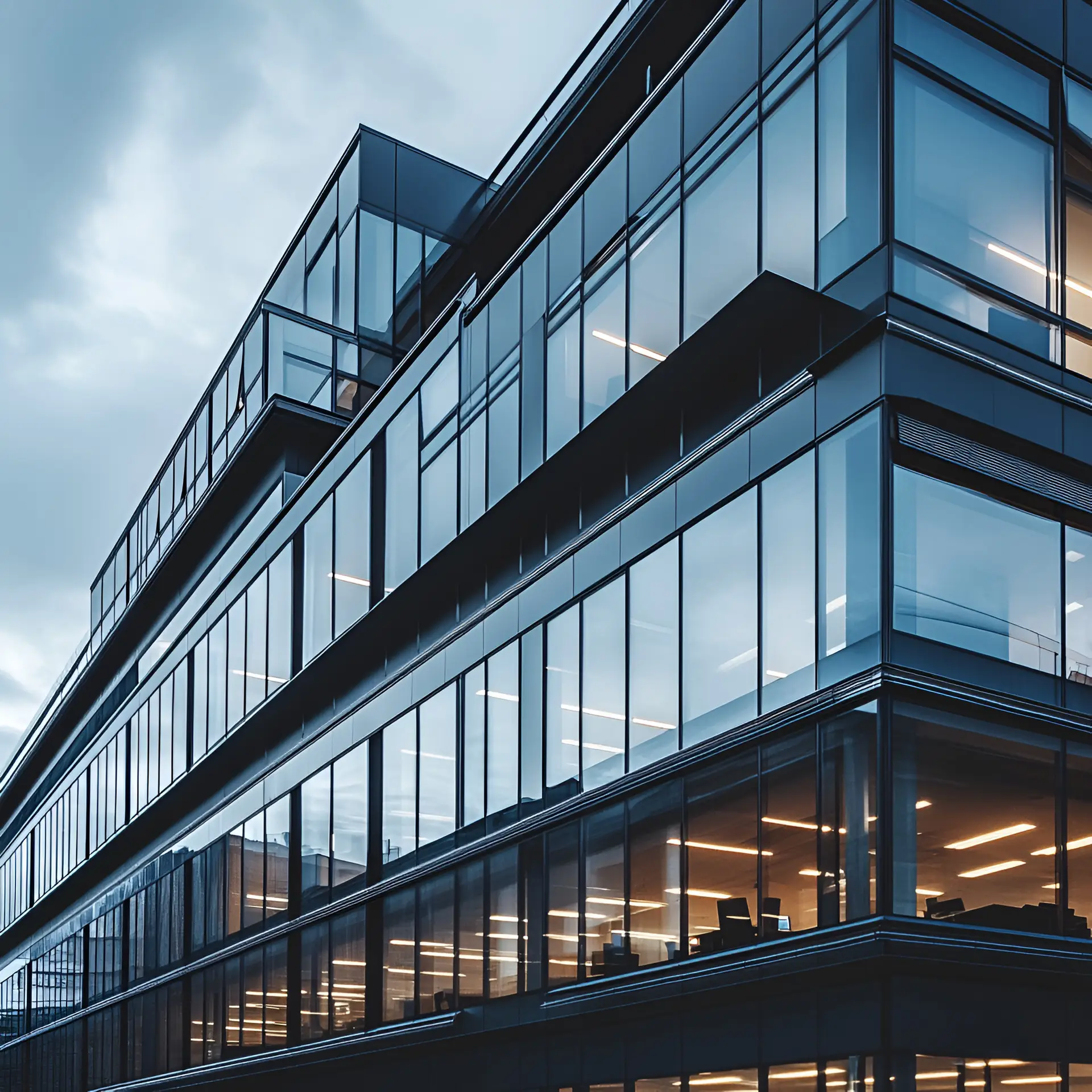 Modern Architectural Marvel: A contemporary office building, its sleek glass facade reflecting the sky, stands as a testament to innovative design and urban development.
