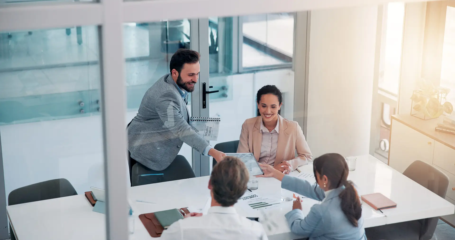 Office, business people and meeting with portfolio for investment, financial proposal and teamwork. Collaboration, employees and stakeholder with document for report review, accounting firm and above