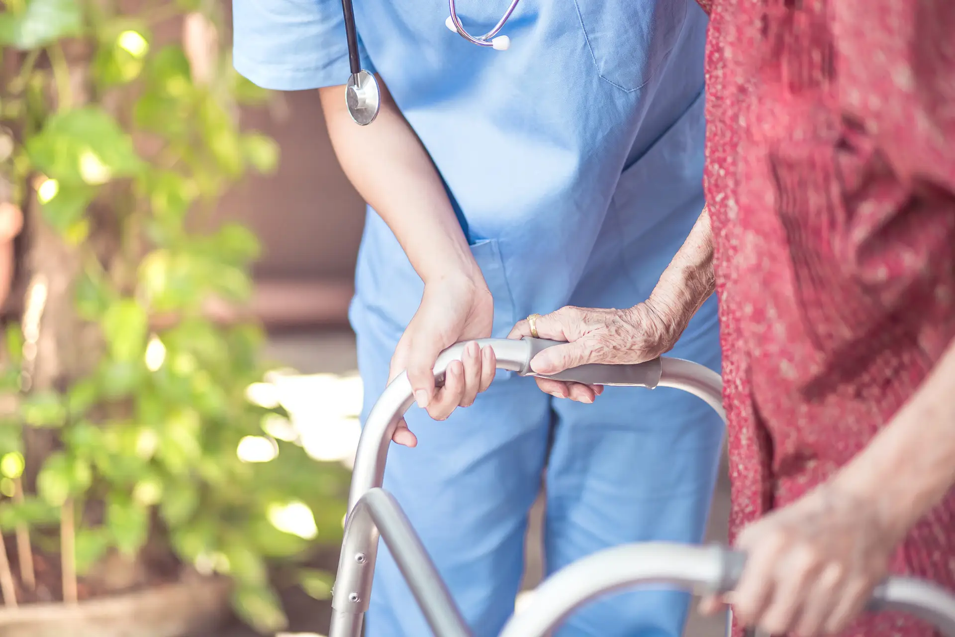 Asian eldery  woman with her caregiver at home. Home care or Eld