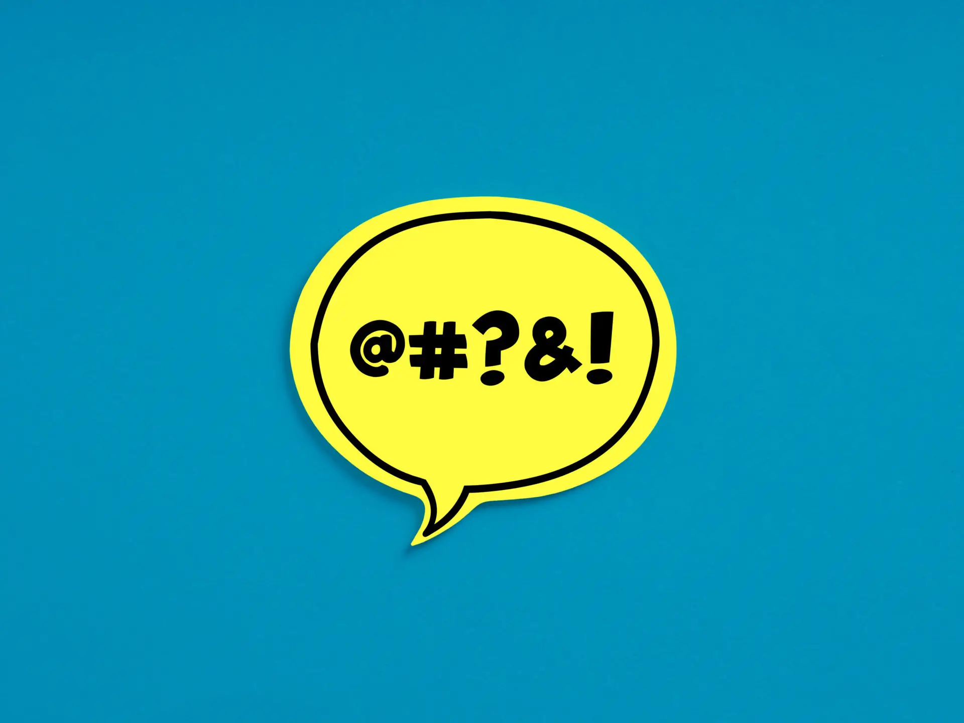 Swear words or cursing on yellow speech bubble on blue background.