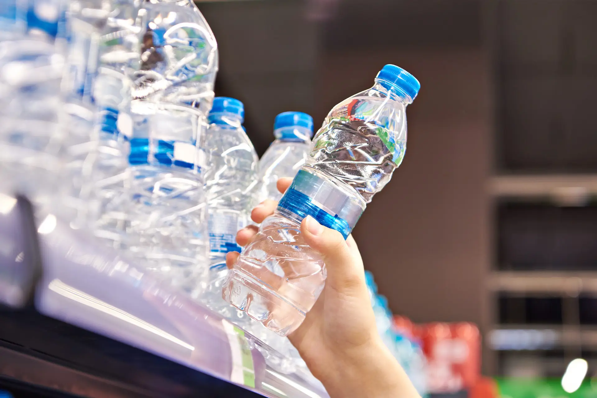 Drinking water in hand at shop