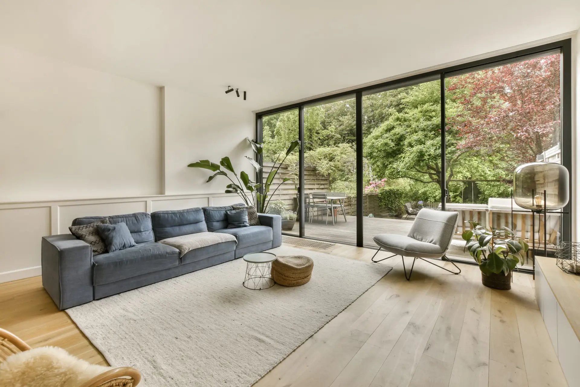a living room with a couch and a large window