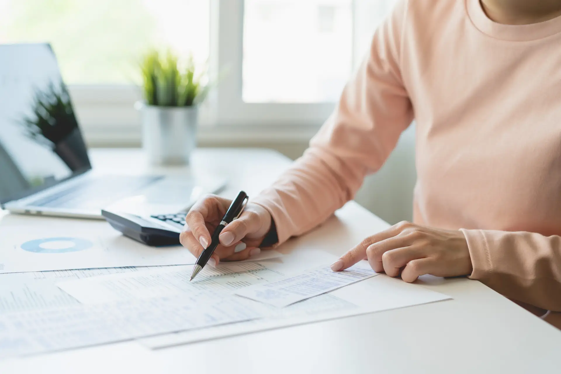 Deduction planning, debt asian young woman  hand using calculator to calculating money balance from bill and income, cost budget expenses for pay money form personal individual on table at home.