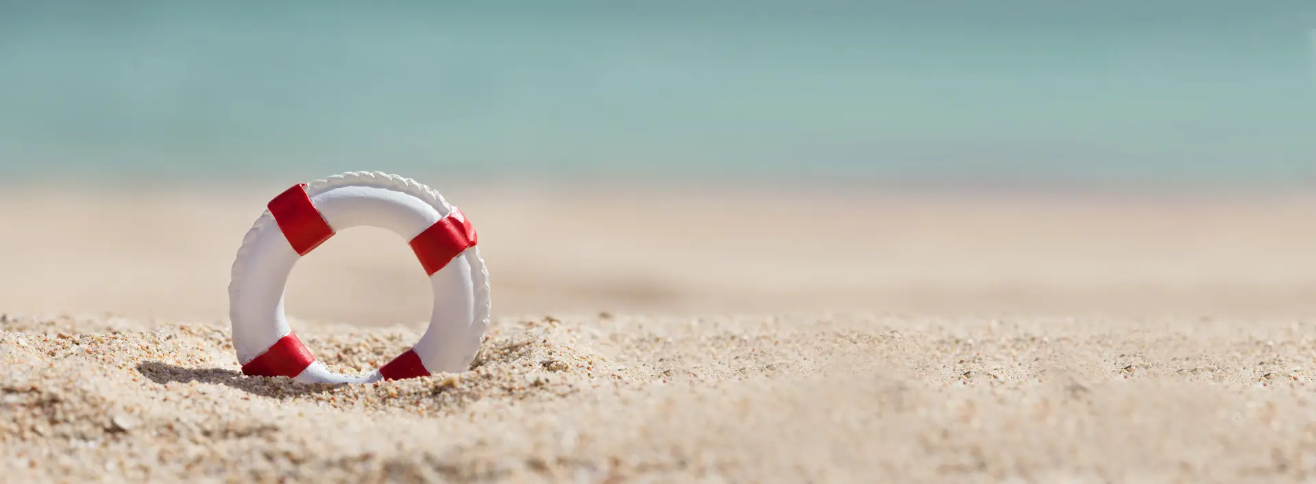 Lifebuoy-on-sand-at-beach
