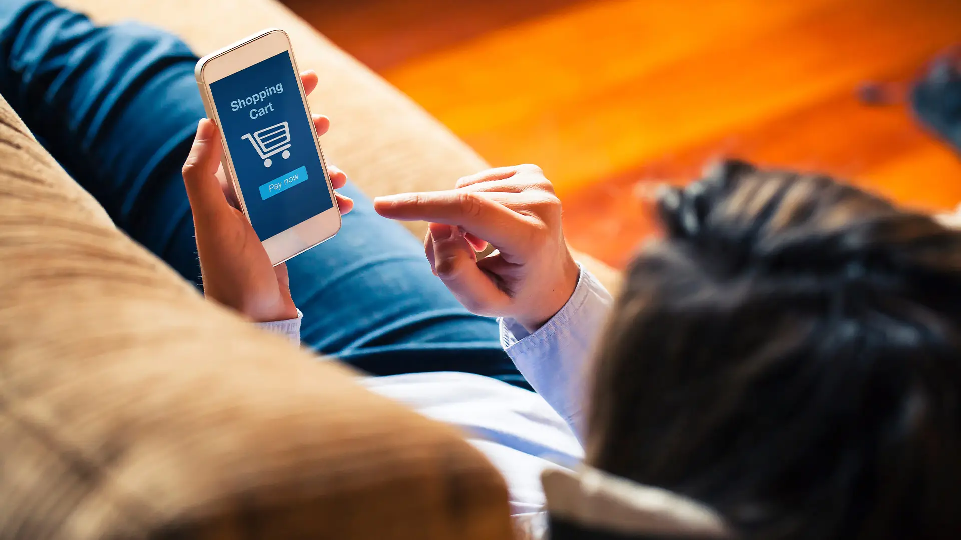 Woman-shopping-mobile-phone-laying-at-home