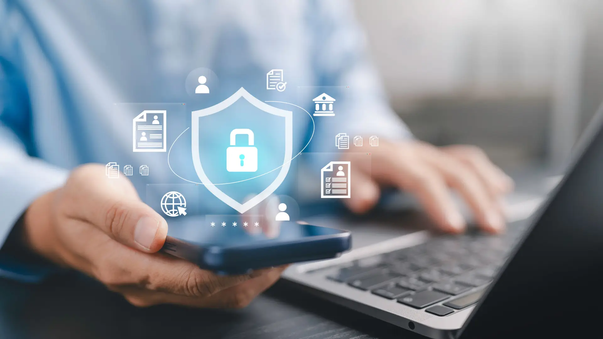 Cyber security, personal data privacy protection, secure online banking, and encrypted digital transaction safety Concept. Businessman using smartphone and laptop with shield and padlock icons.
