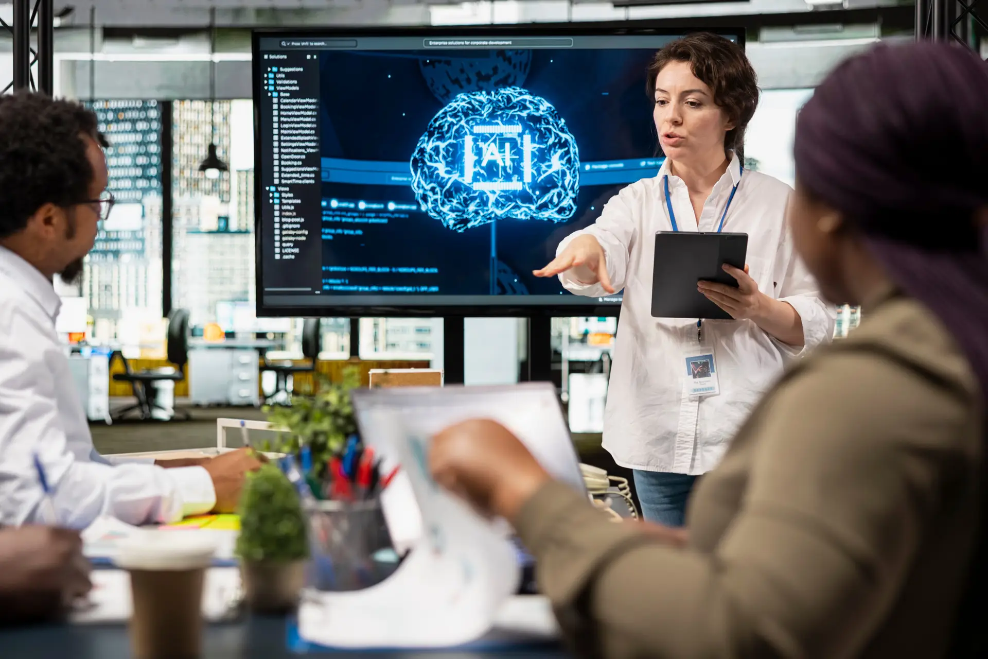 Manager presenting an AI implementation roadmap to a team