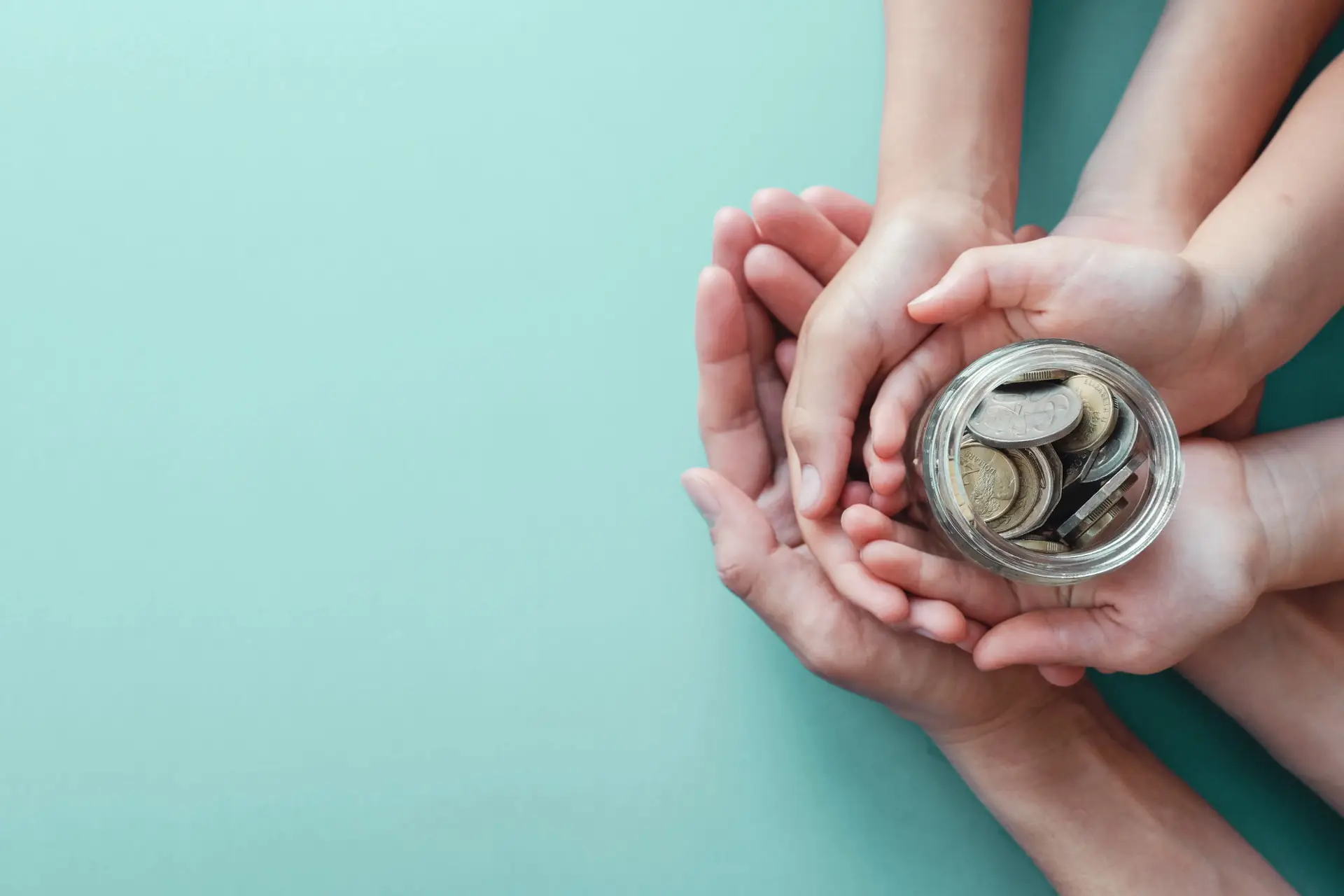 child-adult-holding-money-jar-donation-saving-concept