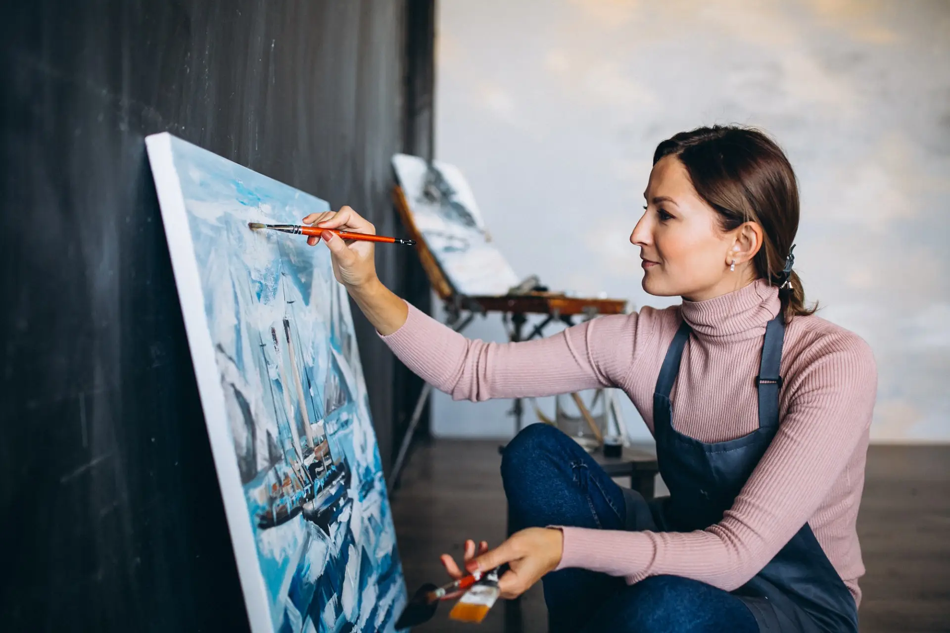 female-artist-painting-studio