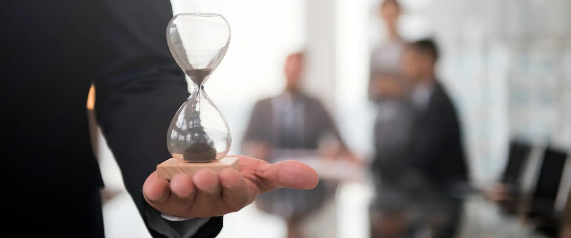 filing-deadlines-hourglass-business-mans-hand-1