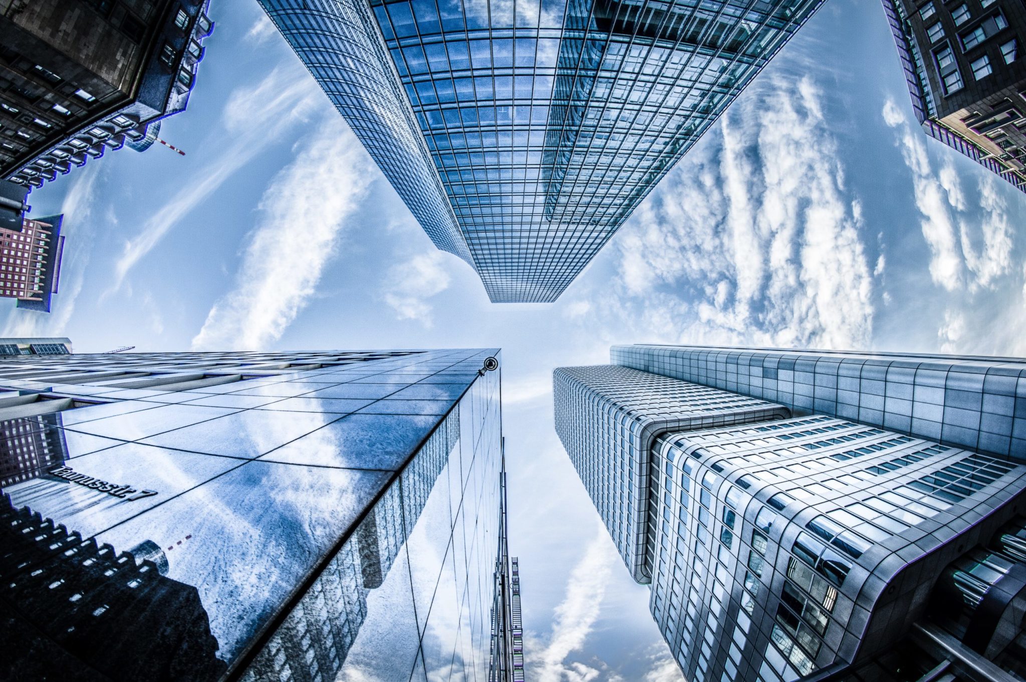 low-angle-photo-of-four-high-rise-curtain-wall-buildings-830891-scaled-1
