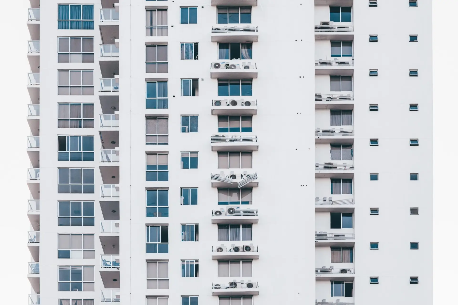 minimalist-photography-of-white-and-gray-condominium-2091634-scaled-1