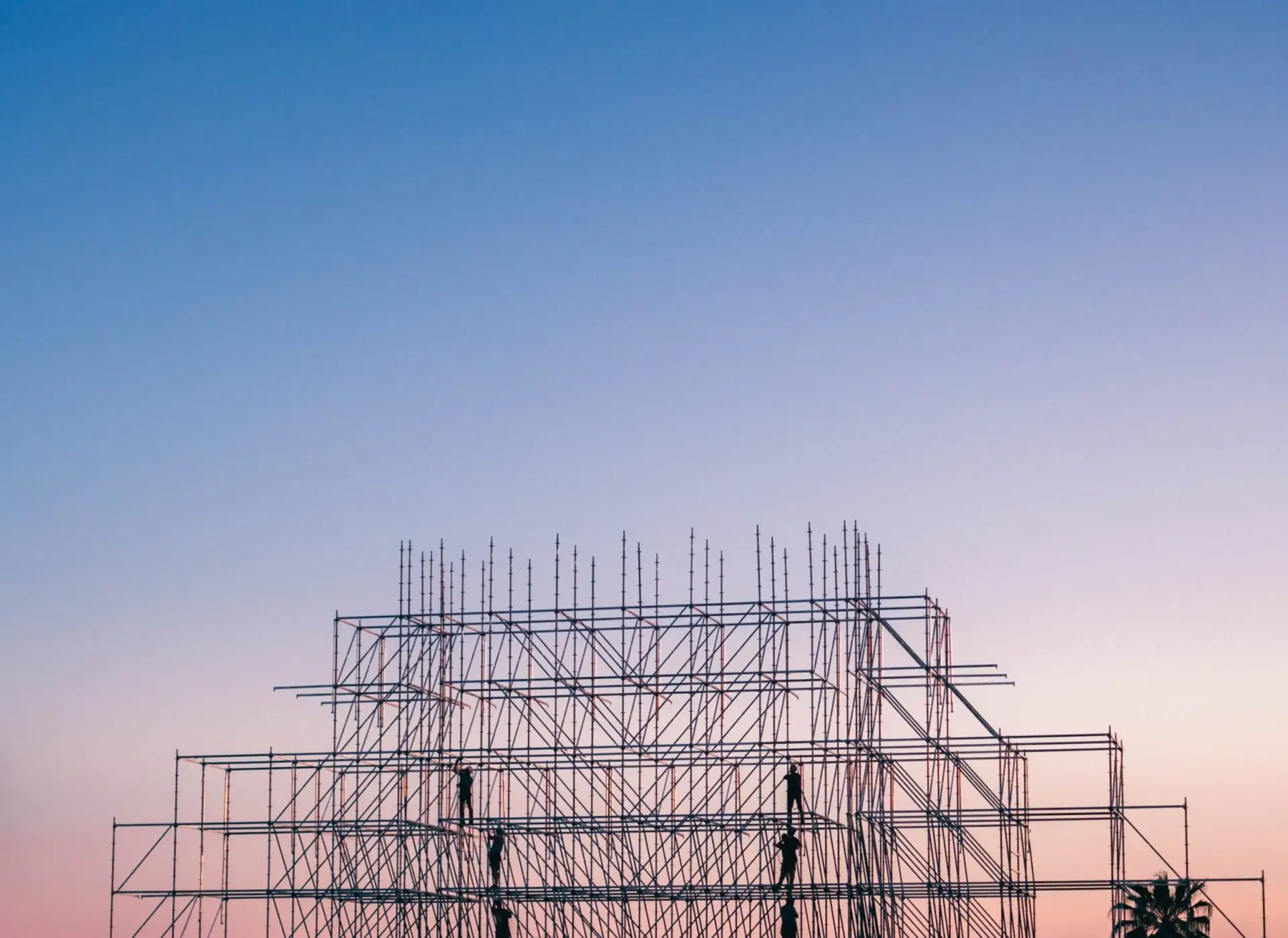 photo-of-people-on-building-under-construction-1117452-scaled-1
