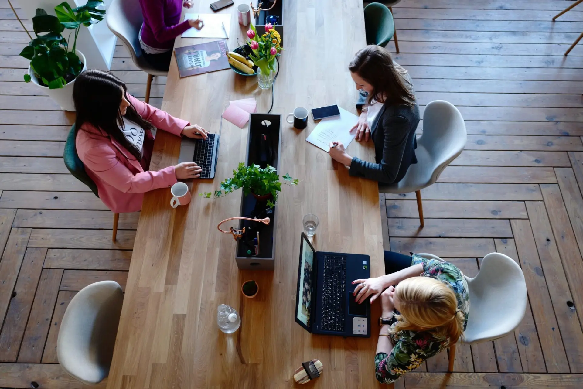 three-woman-sitting-on-white-chair-in-front-of-table-2041627-1-scaled-1